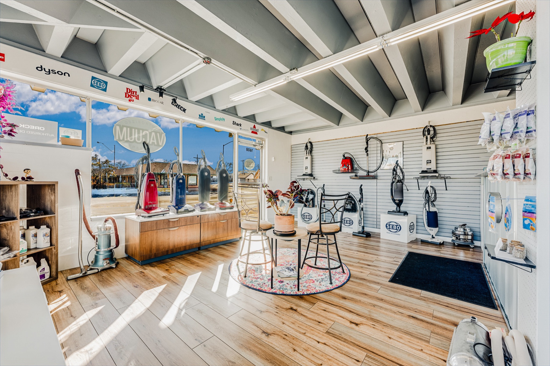Sunlit shop floor with vacuums in the window
